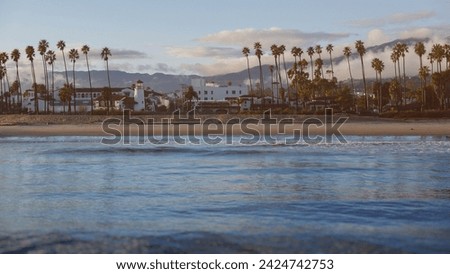 Santa Barbara, California coastline beach shore as seen from Stearns Wharf on a beautiful pacific sunset after a recent rain.