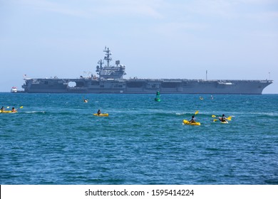 Santa Barbara, California / USA - June 1 2014: Nimitz Class Nuclear-powered Aircraft Carrier, USS Ronald Reagan, In Santa Barbara Harbor With Sea Kayakers In The Foreground