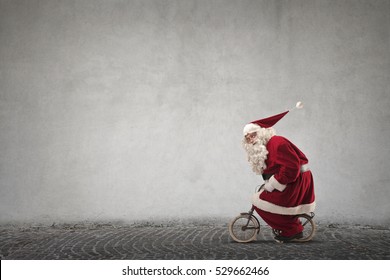 Santa changed the sleigh to a little bike 
