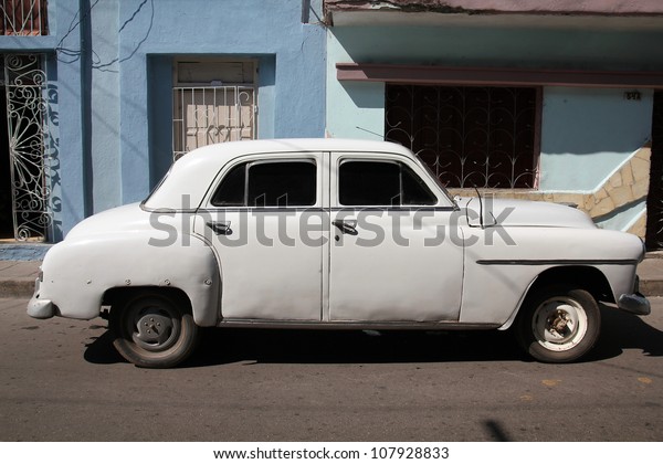 SANTA CLARA, CUBA - FEBRUARY 21: Classic American\
car on February 21, 2011 in Santa Clara, Cuba. Recent law change\
allows the Cubans to trade cars again. Old law resulted in very old\
cars in Cuba.