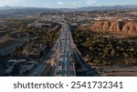 Santa Clarita, California, USA - October 24, 2024: Afternoon rush hour traffic passes on the 5 freeway through downtown Santa Clarita.