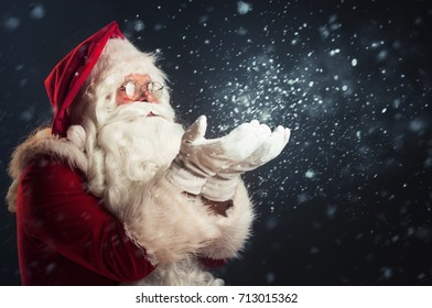 Santa Claus Blowing Magic Snow Of His Hands
