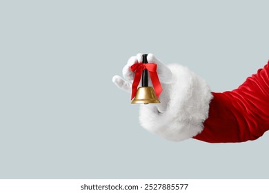 Santa Claus with Christmas bell on grey background - Powered by Shutterstock