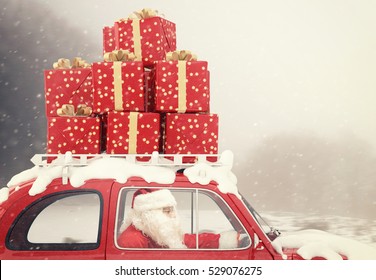 Santa Claus Drives A Red Car Full Of Christmas Present