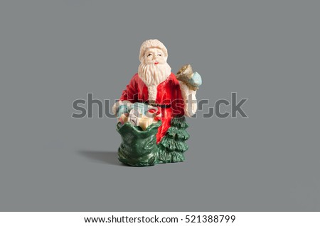 Santa claus figure with a golden bell
