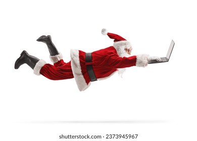 Santa claus flaying and using a laptop computer isolated on white background - Powered by Shutterstock