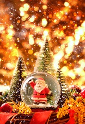 Santa Claus In Glass Ball, Symbol Of New Year And Christmas Holiday. Festive Winter Season. Christmas Holiday Background. Copy Space