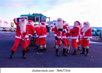 Santa Claus With Green Car Go To Christmas Party In Iceland.