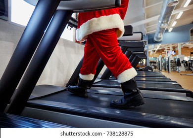 Santa Claus In The Gym Doing Exercises