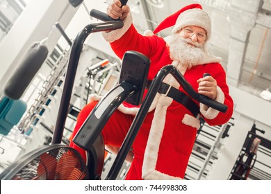 Santa Claus in the gym holiday concept