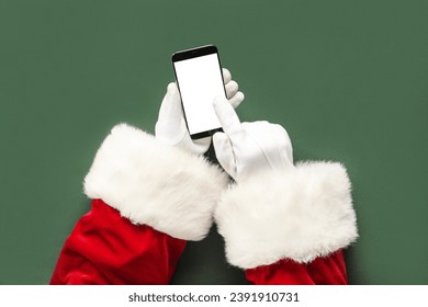 Santa Claus hands with modern mobile phone on color background, closeup - Powered by Shutterstock