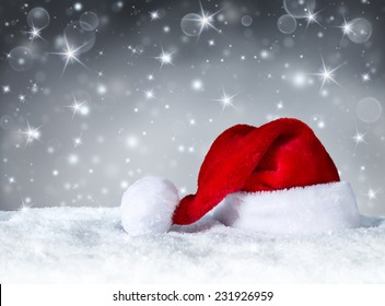 Santa Claus Hat With Snow And Silver Snowfall Background 