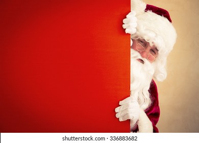 Santa Claus holding banner blank. Christmas holiday concept