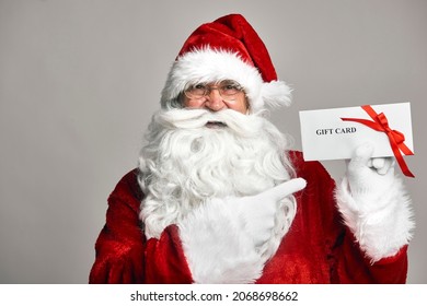 Santa Claus Holding Gift Card In Hands