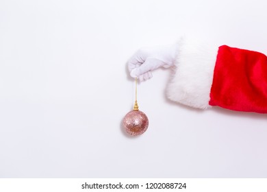 Santa Claus Holding A Pink Bauble On A White Background