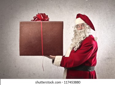 Santa Claus Holding A Present