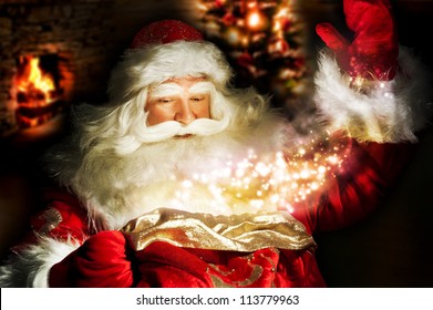 Santa Claus at home at night making magic