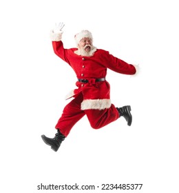 Santa Claus jumping with hands lifted upwards isolated on white background - Powered by Shutterstock