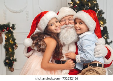 Santa Claus With Kids Indoors Christmas Celebration Concept