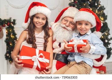 Santa Claus With Kids Indoors Christmas Celebration Concept