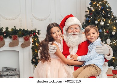 Santa Claus With Kids Indoors Christmas Celebration Concept