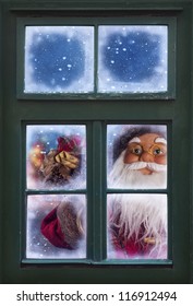 Santa Claus Looking Through A Frosted Window