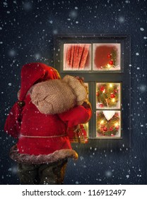 Santa Claus Looking Through A Frosted Window