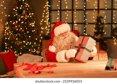 Santa Claus making Christmas gift at home - Powered by Shutterstock