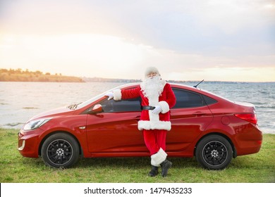 Santa Claus near car on riverside - Shutterstock ID 1479435233