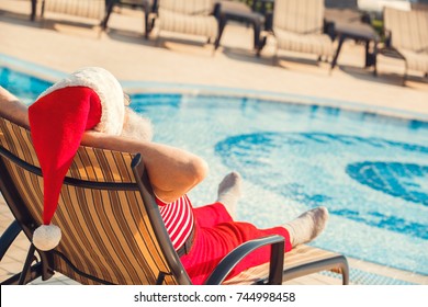 Santa Claus Near The Pool Holiday Vacation Concept