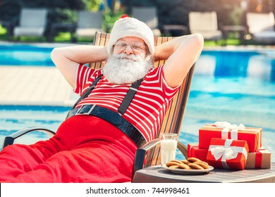 Santa Claus Near The Pool Holiday Vacation Concept