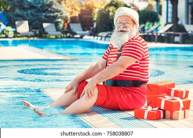 Santa Claus Near The Pool Holiday Vacation Concept