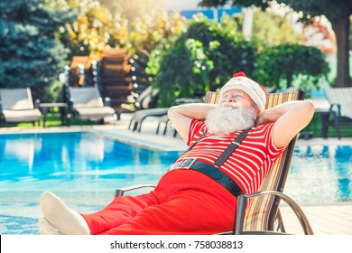 Santa Claus Near The Pool Holiday Vacation Concept