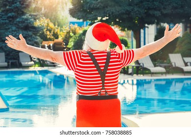 Santa Claus Near The Pool Holiday Vacation Concept