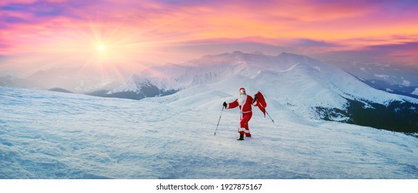 Santa Claus for New Year in a red suit with a bag of gifts at sunrise on the Montenegrin ridge at the top of Hoverla - the highest peak of Ukraine, 2061 meters - Powered by Shutterstock