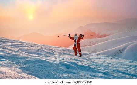 Santa Claus for New Year in a red suit with a bag of gifts at sunrise on the Montenegrin ridge at the top of Hoverla - the highest peak of Ukraine, 2061 meters - Powered by Shutterstock