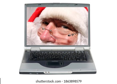 Santa Claus On A Computer Screen. Santa Claus Uses His Web Cam To Chat With Everyone While Online In The North Pole. Christmas With Santa. 