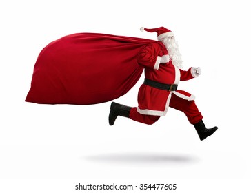 Santa Claus On The Run To Delivery Christmas Gifts Isolated On White Background