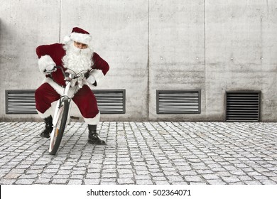santa claus on white small bike and gray big wall for your decoration 