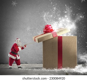 Santa Claus Opening A Big Red Gift