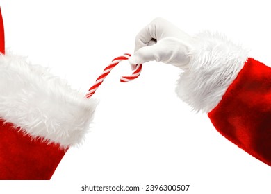 Santa Claus placing a traditional candy cane into a Christmas Stocking isolated - Powered by Shutterstock