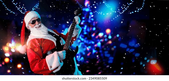 Santa Claus playing the electric guitar in a nightclub at a Christmas and New Year party or Corporate events. Senior rockstar guitar player as Santa at a rock concert, festival, or celebration. - Powered by Shutterstock