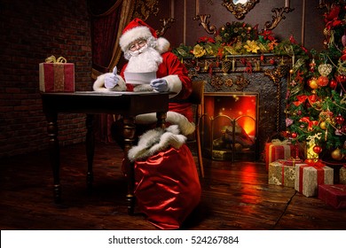 Santa Claus is preparing for Christmas, he is reading children's letters. Mail of Santa Claus. Christmas decoration. 