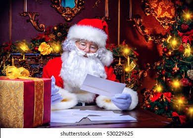 Santa Claus is preparing for Christmas, he is reading children's letters. Mail of Santa Claus. Christmas decoration. 