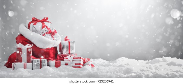 Santa Claus red bag with gift boxes. 