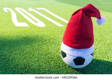 Santa Claus red hat on soccer ball with text new year 2017 - Powered by Shutterstock