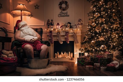 Santa Claus Relaxing After Or Before Work In Cozy Christmas Room 