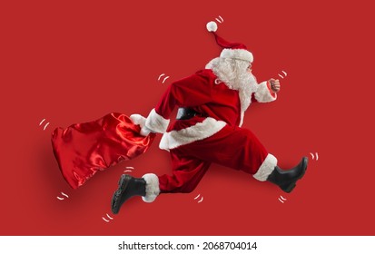 Santa claus runs fast to deliver all gifts