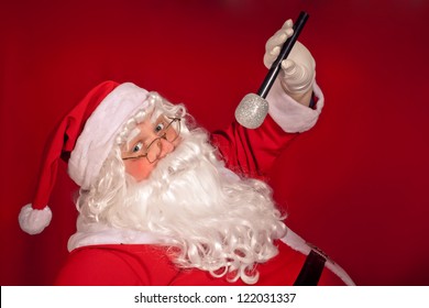 Santa Claus Singing Over Red Background