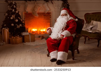 Santa Claus sits in a cozy chair by the fireplace with a Christmas tree, surrounded by Christmas decorations and gifts. - Powered by Shutterstock